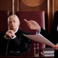Why is settlement out of court more common than and preferable to going to trial?