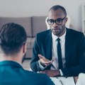 What job defends people in court?
