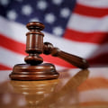 Can a criminal defense attorney represent me in both state and federal court?
